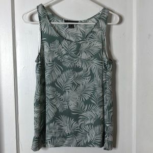 Teal shirt with white leaf design